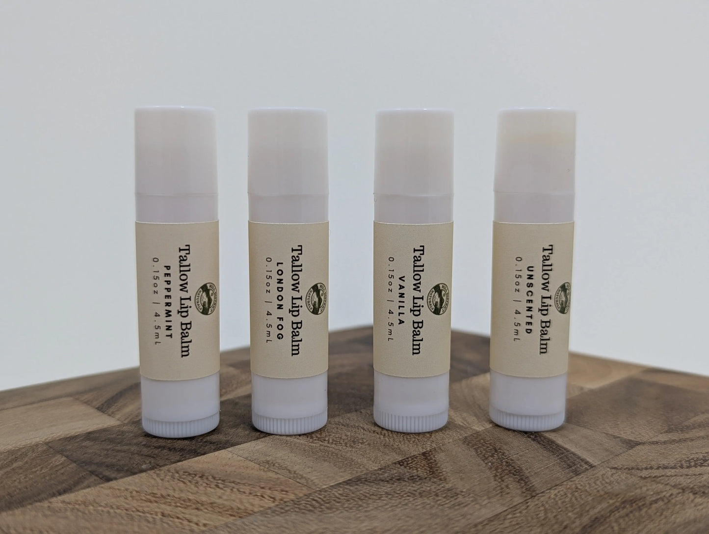 Set of four beef tallow lip balms, assorted scents, packaged together